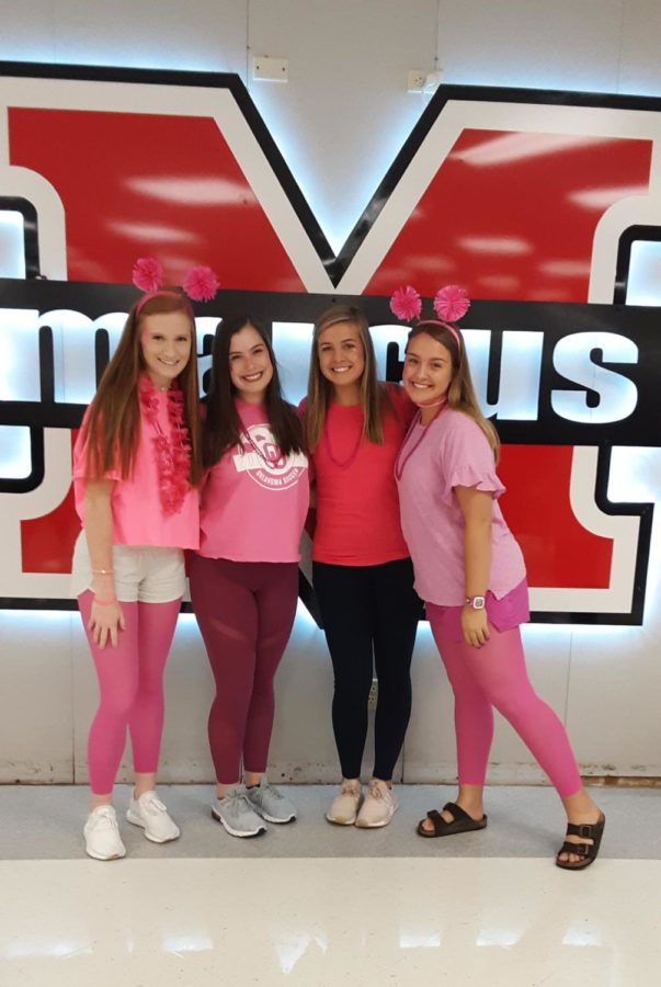 Students celebrate pink out day on Oct. 11 before the varsity football game against Herbron. The game resulted in a 24-14 win for the Marauders.