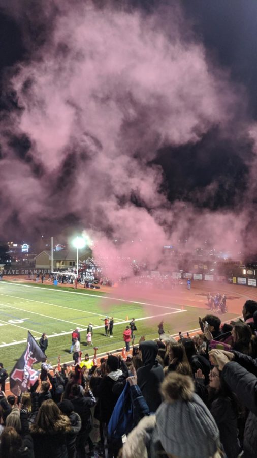 Students celebrated a Marauder touchdown at the battle of the Axe on Nov. 8 by shooting a cloud of colored powder into the air. The Marauders won the game 48-42 in overtime. 