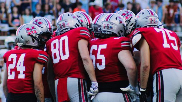 Colton Nussmeier, Sophomore quarterback, calls a play in the huddle during the 1st quarter of the Marauders season-opening victory over Keller, 14-10, on Friday, August 31, 2024.