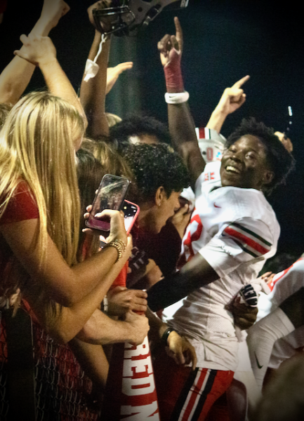 Senior defensive back Taylor Haslem (18) celebrates with the student section after Marcus' 33-32 "Mound Showdown" victory over Flower Mound on October 25, 2024. 