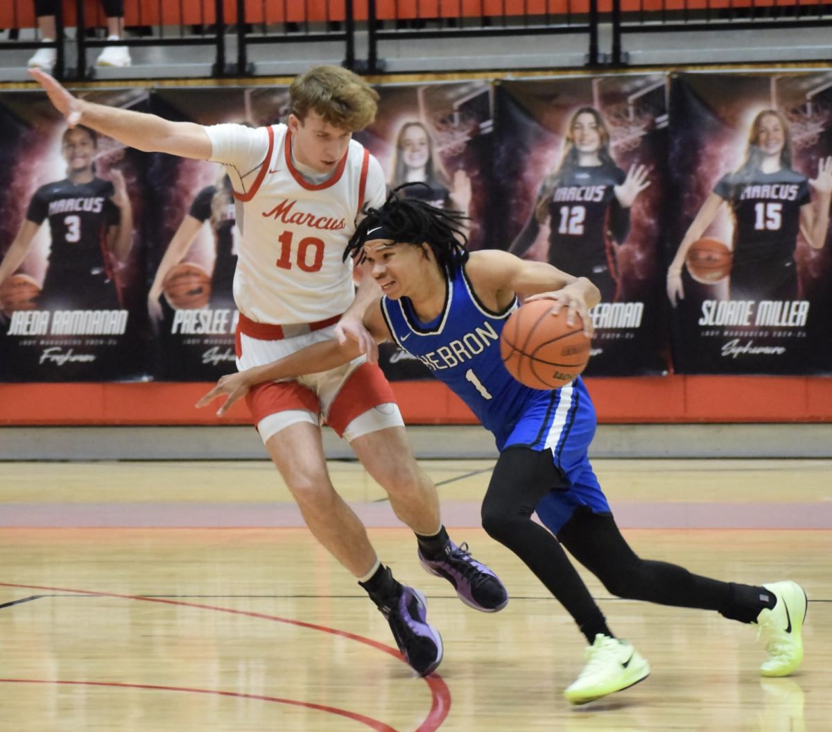 Nixxon Warren, 12, prevents a Hebron guard from driving the lane during the Marauders 61-57 home victory on January 17, 2025.